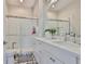 Modern bathroom featuring a double sink vanity, sleek subway tile shower, and stylish patterned floors, a spa-like experience at 1410 E Curtis St # 2, Tampa, FL 33603