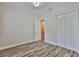 Bright bedroom with hardwood floors, closet and access to an additional room at 1410 E Curtis St # 2, Tampa, FL 33603