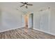 Inviting bedroom featuring wood-look floors, barn door, and ample natural light, creating a comfortable and stylish retreat at 1410 E Curtis St # 2, Tampa, FL 33603