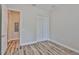 Clean bedroom with hardwood floors, closet and access to an additional room at 1410 E Curtis St # 2, Tampa, FL 33603