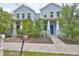 Charming blue two-story home with a welcoming front porch and well-maintained landscaping at 1410 E Curtis St # 2, Tampa, FL 33603