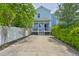 Charming light blue two-story home featuring a welcoming porch and spacious driveway at 1410 E Curtis St # 2, Tampa, FL 33603