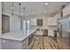 Modern kitchen with stainless steel appliances, a large island, and white cabinetry with lots of natural light at 1410 E Curtis St # 2, Tampa, FL 33603