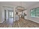 Modern kitchen with stainless steel appliances, a large island, and white cabinetry with plenty of space at 1410 E Curtis St # 2, Tampa, FL 33603