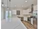 Modern kitchen with stainless steel appliances, a large island, and white cabinetry with lots of natural light at 1410 E Curtis St # 2, Tampa, FL 33603