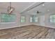Open-concept living room with hardwood floors, recessed lighting, and modern fixtures with lots of sunlight at 1410 E Curtis St # 2, Tampa, FL 33603