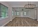 Bright living room features hardwood floors, recessed lighting, and ample natural light from the windows at 1410 E Curtis St # 2, Tampa, FL 33603