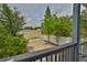 Scenic porch view overlooking lush greenery, a white fence, and a private outdoor space, ideal for enjoying nature at 1410 E Curtis St # 2, Tampa, FL 33603