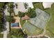 Aerial view of community amenities showing tennis, basketball, and playground at 16226 Carnoustie Dr, Odessa, FL 33556