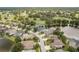 Expansive aerial view shows homes surrounding ponds and a well-maintained golf course at 16226 Carnoustie Dr, Odessa, FL 33556