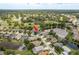 Aerial view of home in a community featuring beautiful lakes and a golf course at 16226 Carnoustie Dr, Odessa, FL 33556