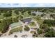 Aerial of golf clubhouse, course, and surrounding natural beauty at 16226 Carnoustie Dr, Odessa, FL 33556