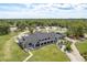 Aerial view of community clubhouse with golf course and landscaping at 16226 Carnoustie Dr, Odessa, FL 33556
