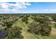 Aerial view of the community showcasing the golf course, lakes, and surrounding neighborhood at 16226 Carnoustie Dr, Odessa, FL 33556