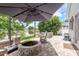 Lakefront backyard featuring a fire pit and patio seating at 16226 Carnoustie Dr, Odessa, FL 33556