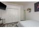 Bedroom with large closet space, tv, and bright natural light at 16226 Carnoustie Dr, Odessa, FL 33556