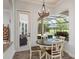 Cozy breakfast nook with views of the outdoor pool and a screened-in patio at 16226 Carnoustie Dr, Odessa, FL 33556