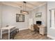 Home office featuring bright lighting and a decorative mirror at 16226 Carnoustie Dr, Odessa, FL 33556
