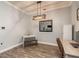 Dining area with contemporary lighting, neutral color palette, and workspace at 16226 Carnoustie Dr, Odessa, FL 33556
