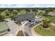 Beautiful golf clubhouse with golf carts parked in front at 16226 Carnoustie Dr, Odessa, FL 33556