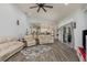 Spacious living room with a large rug that leads to an open kitchen layout at 16226 Carnoustie Dr, Odessa, FL 33556