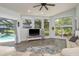 Bright living room features a large fan and backyard views at 16226 Carnoustie Dr, Odessa, FL 33556