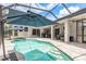 Spacious screened-in lanai with a pool and spa at 16226 Carnoustie Dr, Odessa, FL 33556