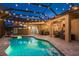 Backyard lanai with a pool, hot tub, and outdoor furniture at 16226 Carnoustie Dr, Odessa, FL 33556