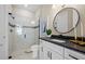 Modern bathroom featuring a glass-enclosed shower, sleek black fixtures, and a stylish vanity at 16423 Sapphire Point Dr, Lakewood Ranch, FL 34211