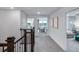 Bright upstairs hallway showing views of the living areas, bedrooms, and natural light at 16423 Sapphire Point Dr, Lakewood Ranch, FL 34211