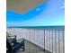 Relax on this private balcony overlooking the beach with comfortable seating and ocean views at 18650 Gulf Blvd # 314, Indian Shores, FL 33785