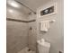 Bathroom featuring a shower stall, a toilet, and a decoratively framed wall art at 18650 Gulf Blvd # 314, Indian Shores, FL 33785