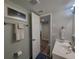 Well-lit bathroom features a sink, mirror, towel rack, and adjacent toilet area at 18650 Gulf Blvd # 314, Indian Shores, FL 33785