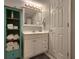 Bathroom featuring a single vanity, cabinet and decorrative storage at 18650 Gulf Blvd # 314, Indian Shores, FL 33785