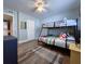 Bedroom features a bunk bed, wood floors, ceiling fan, and closet, offering ample sleeping and storage space at 18650 Gulf Blvd # 314, Indian Shores, FL 33785