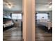 Split bedroom with a bunk bed and a queen bed, coastal decor, and ceiling fans at 18650 Gulf Blvd # 314, Indian Shores, FL 33785