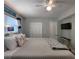 Bedroom with a king-size bed, coastal decor, ceiling fan and an interior closet at 18650 Gulf Blvd # 314, Indian Shores, FL 33785
