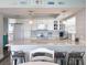 Well-equipped kitchen with white cabinets, quartz countertops, and stainless steel appliances at 18650 Gulf Blvd # 314, Indian Shores, FL 33785