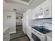 Well-maintained kitchen with modern appliances and seamless flow into dining area at 18650 Gulf Blvd # 314, Indian Shores, FL 33785