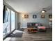 Bright living room with a large sliding glass door leading to a private balcony with ocean views at 18650 Gulf Blvd # 314, Indian Shores, FL 33785