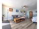 Inviting living room with coastal decor, comfortable seating, and a ceiling fan at 18650 Gulf Blvd # 314, Indian Shores, FL 33785