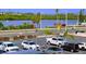 Well-maintained parking lot view with multiple cars and scenic views of the bay at 18650 Gulf Blvd # 314, Indian Shores, FL 33785