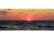 Beautiful ocean sunset view with orange skies and calm waters reflecting the sunlight at 18650 Gulf Blvd # 314, Indian Shores, FL 33785