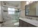 Updated bathroom features a tub with a sliding glass door at 2165 Campus Dr, Clearwater, FL 33764