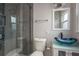 Updated bathroom boasts a modern vanity and glass shower at 2165 Campus Dr, Clearwater, FL 33764