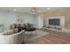 Beautiful living room with modern finishes, decorative fireplace, and hardwood floors at 2165 Campus Dr, Clearwater, FL 33764