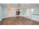 Open-concept living room featuring a combination of hardwood flooring and tile flooring at 2165 Campus Dr, Clearwater, FL 33764