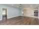 Open-concept living room featuring a combination of hardwood flooring and tile flooring at 2165 Campus Dr, Clearwater, FL 33764