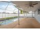 Screened-in lanai with sparkling swimming pool and a spacious covered patio area at 2165 Campus Dr, Clearwater, FL 33764