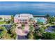 Stunning waterfront property with a beautiful building, pool, and lush tropical landscaping at 219 Pompano Se Dr # D, St Petersburg, FL 33705